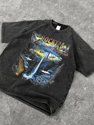 Black vintage wash t-shirt with a graphic print of the Rockies mountains and waterfall.
