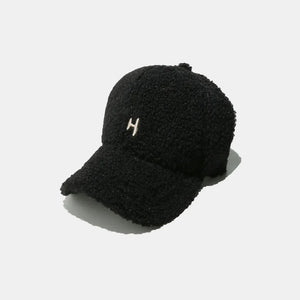 Black textured sherpa baseball cap with embroidered H detail