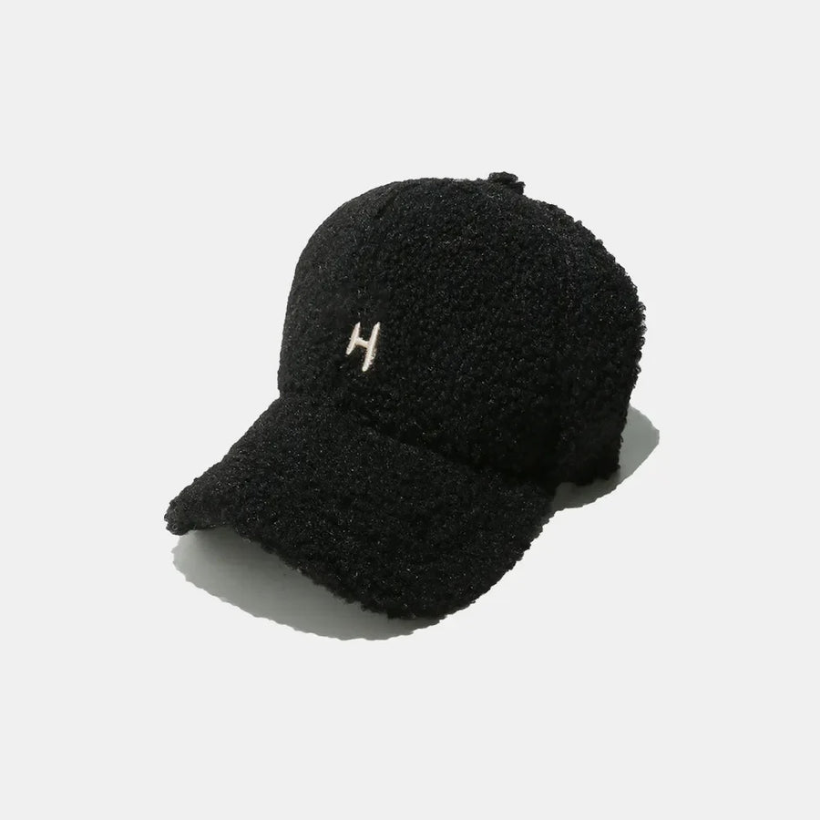 Black textured sherpa baseball cap with embroidered H detail
