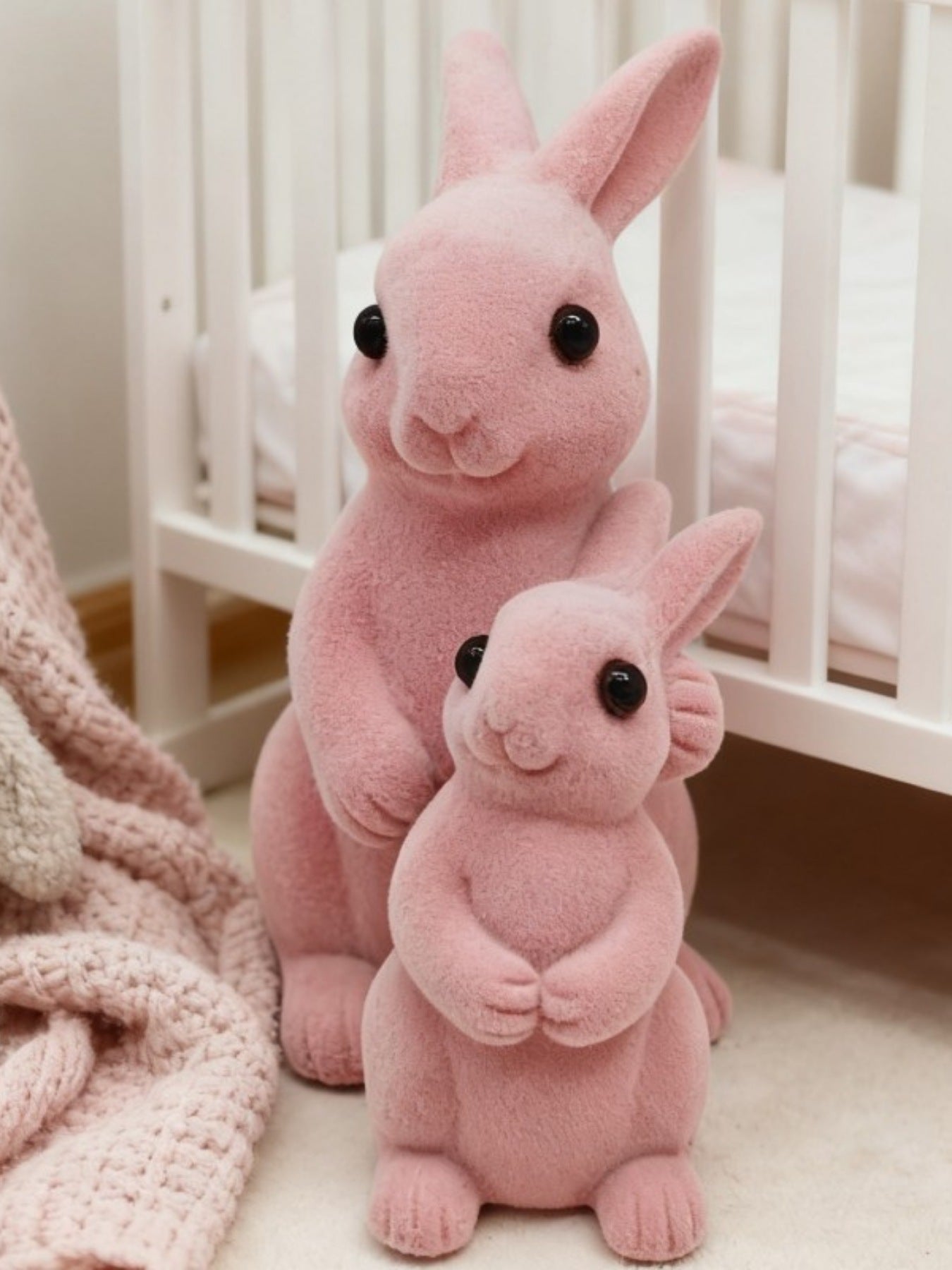 Charming pink flocked bunny decorative ornaments with black eyes, 6 and 9 inch sizes.