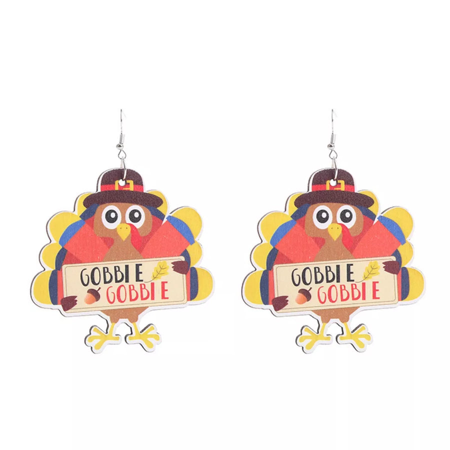 Playful Thanksgiving turkey dangle earrings with brown hats and "Gobble Gobble" signs.