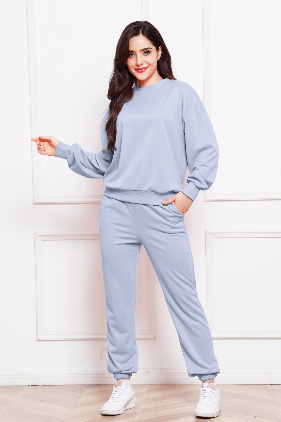 Light blue relaxed fit loungewear set with crewneck sweatshirt and jogger pants.