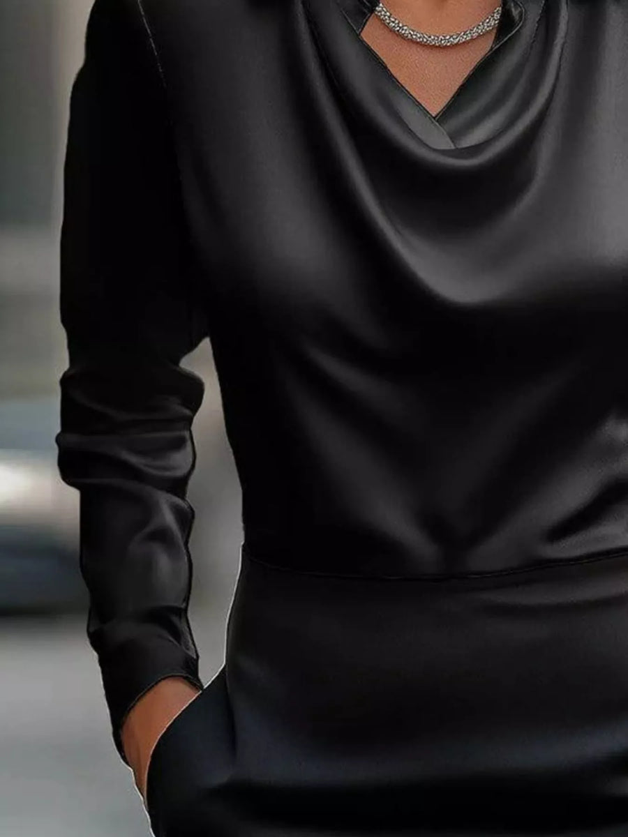 Black satin cowl neck long-sleeve blouse with a draped neckline.