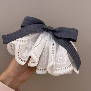 hair clip in ivory featuring lace trim and flared fit