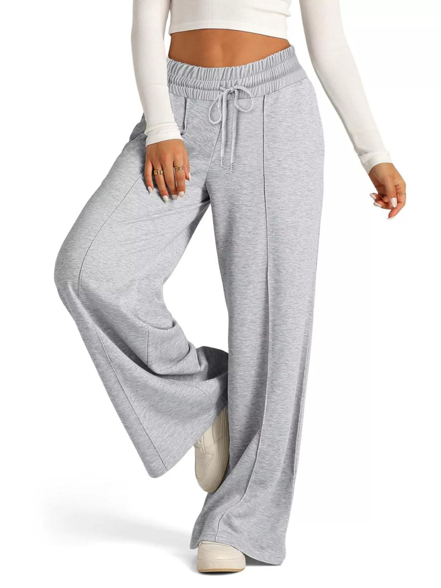 Light gray wide-leg drawstring lounge pants with a relaxed fit and front seam detail.