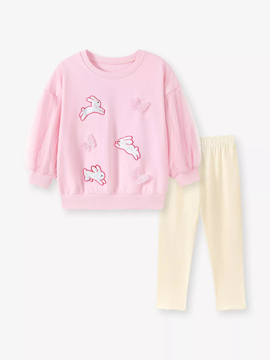 cream sweatshirt and leggings set featuring mesh sleeves and novelty print