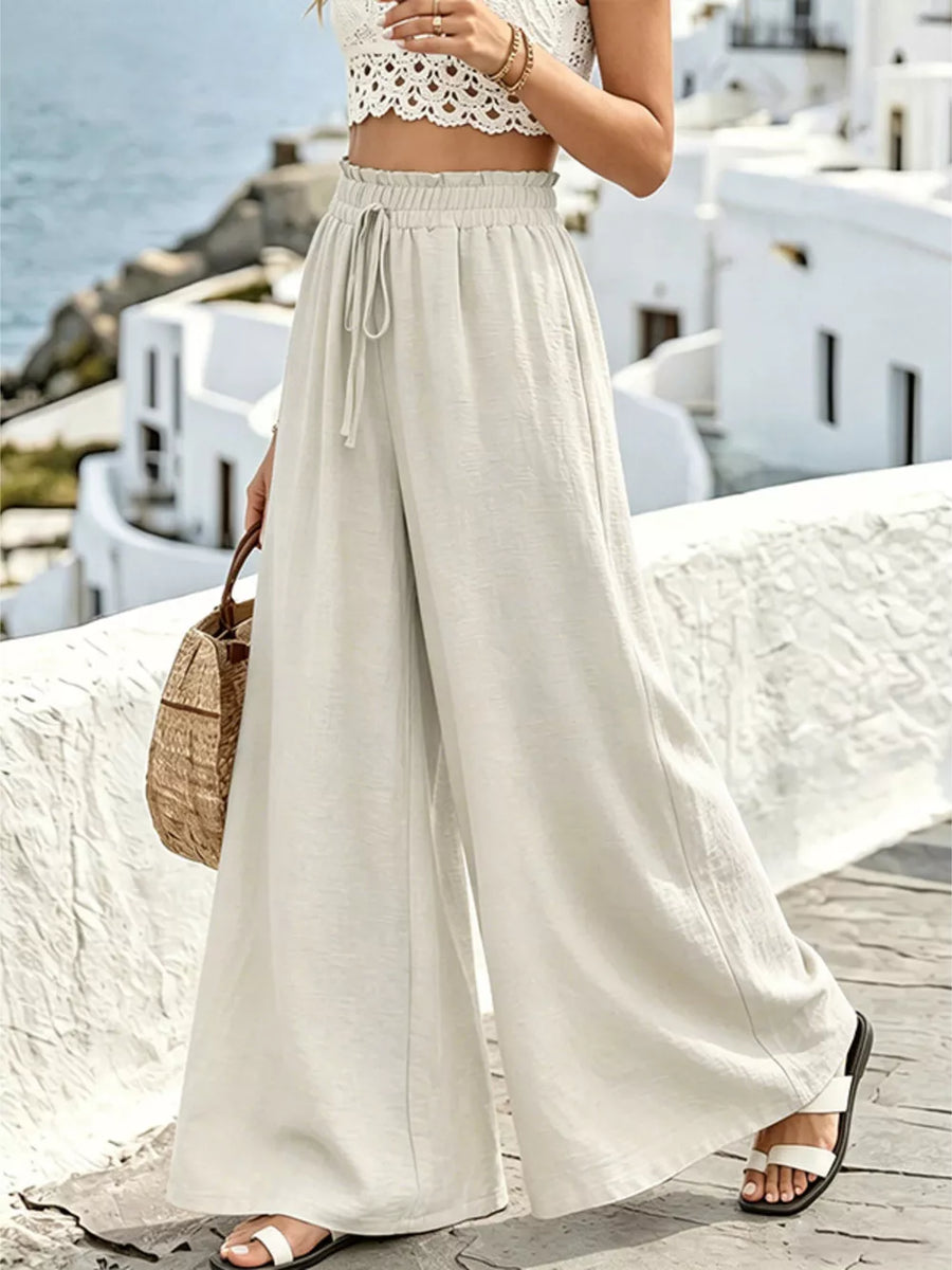 Cream linen wide-leg pants with drawstring waist and pockets