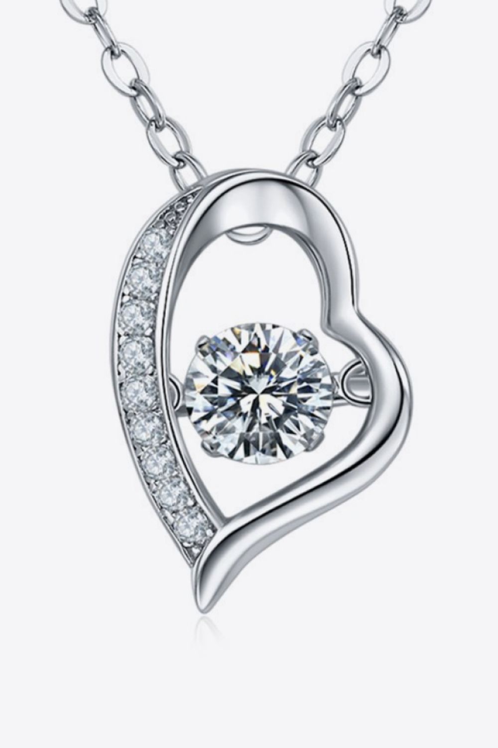 Silver heart pendant necklace with a dancing diamond and pave crystal accents.