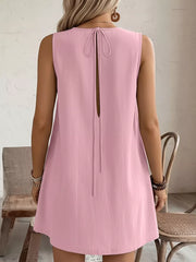 Blush pink sleeveless dress with back tie detail and open back.