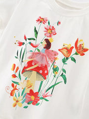White cotton toddler t-shirt with whimsical fairy, mushroom, and floral graphic print.
