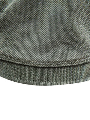 Sage textured polo shirt hem detail with ribbed band
