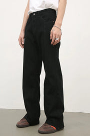 Black flare jeans with panel seams and a slight split hem detail.