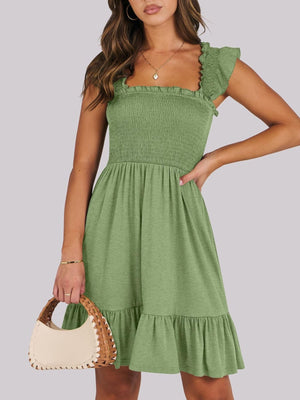 Sage smocked ruffle hem mini dress with square neckline and flutter sleeves.