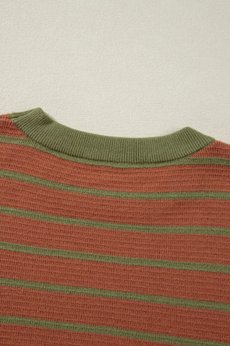 Brown waffle knit top with green stripes and crew neck detail