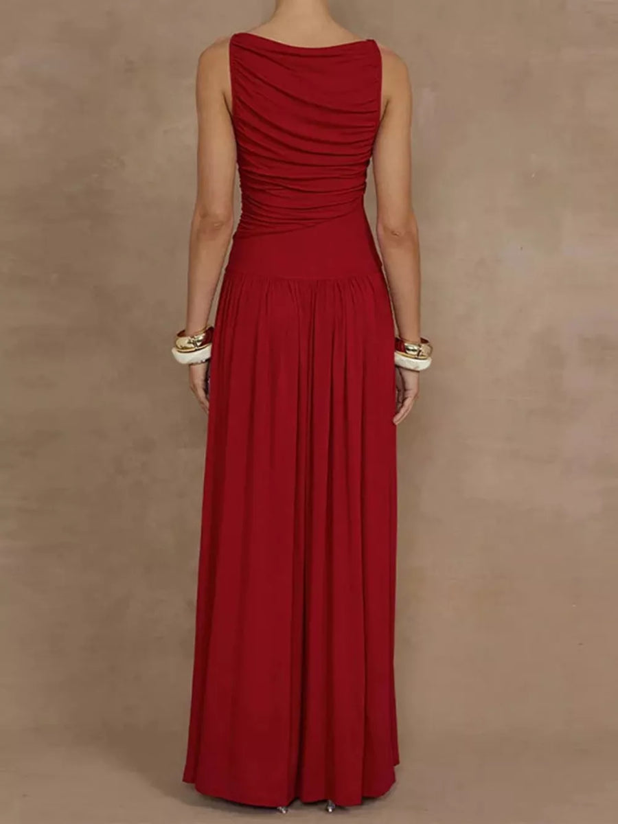Deep red ruched maxi dress with gathered neckline and flowing skirt.