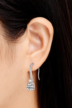 Silver moissanite cascade drop earrings with a square-cut center stone and pave accents.