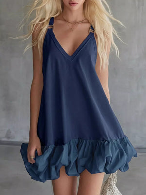 Navy V-neck mini dress with bubble hem and ruffled detail.