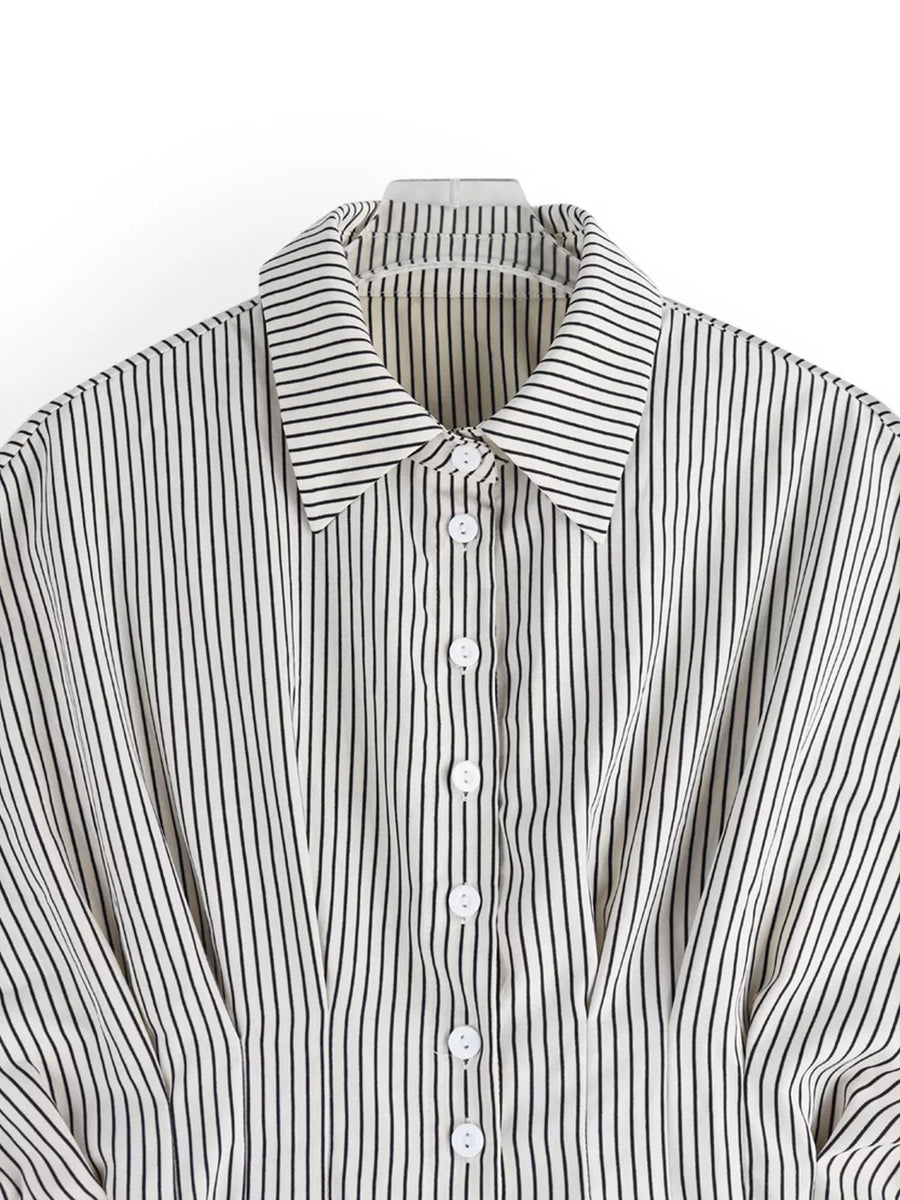 Maternity shirt with black vertical stripes, button-down front, and cinched waist detail.