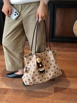 shoulder bag in tan featuring shoulder straps and relaxed fit