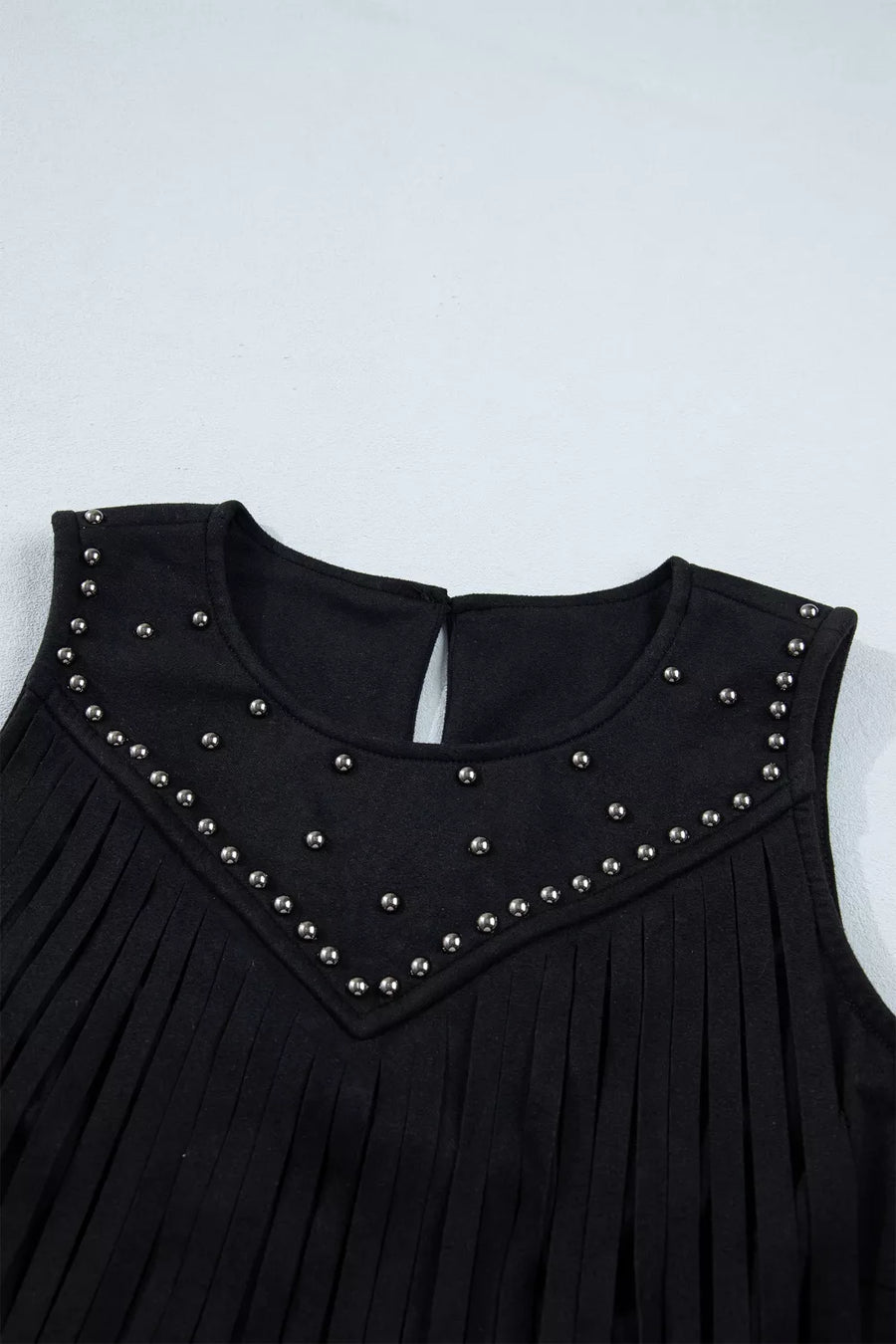 Black tank top with rhinestone embellishments and fringe detail.