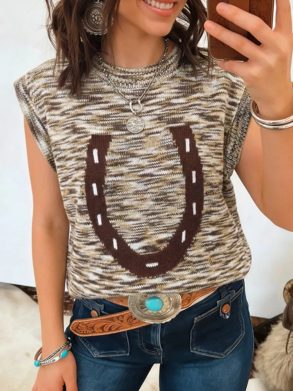 Horseshoe knit sweater vest with brown and tan marled pattern and mock neck.