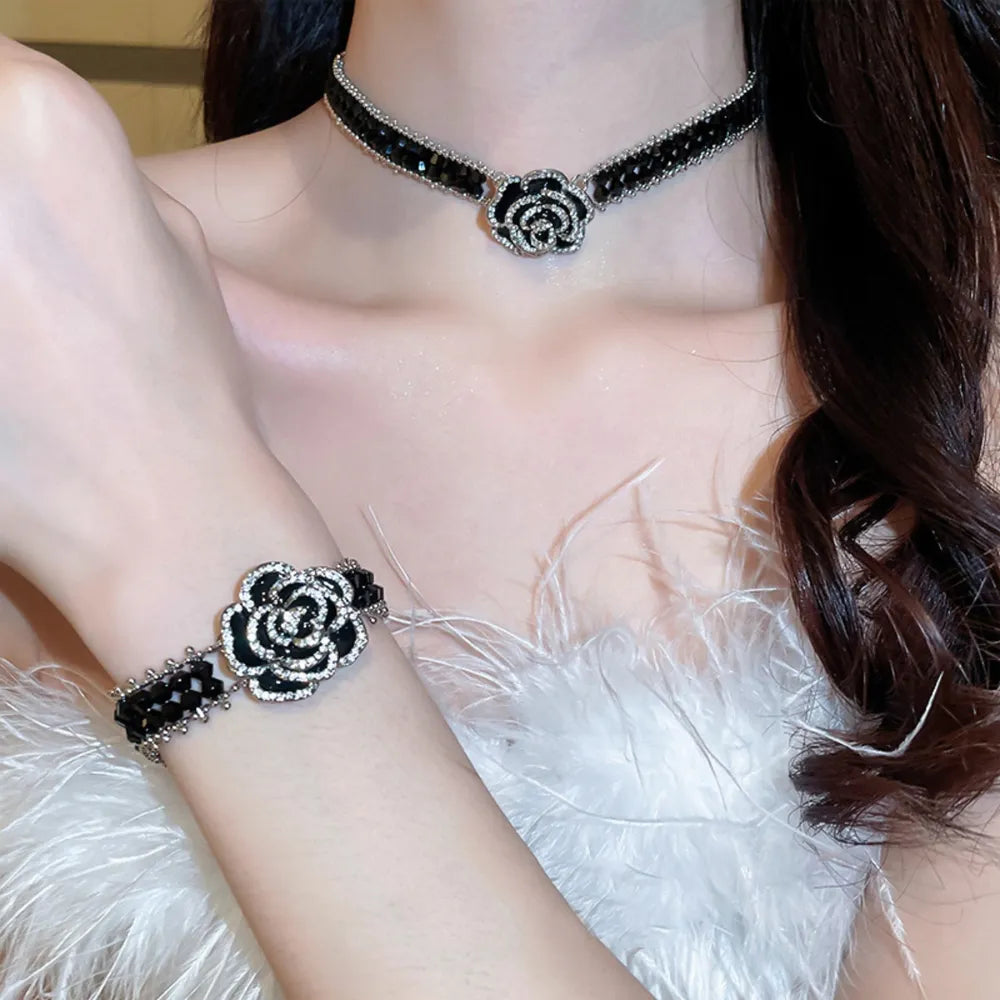 Black rose petal embellished bracelet with crystal accents and beaded details.