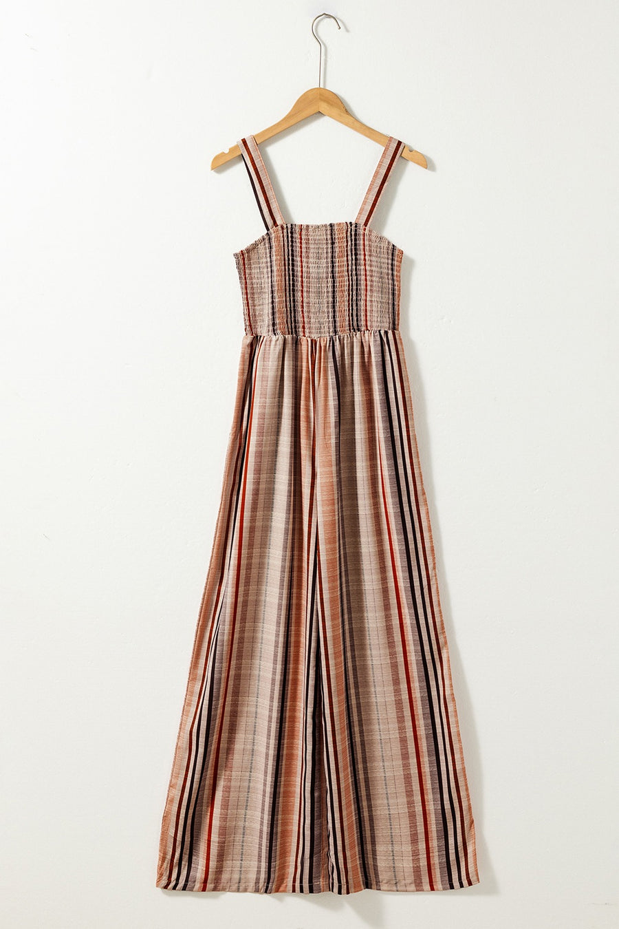 Striped square neck wide-leg romper with smocked bodice and adjustable straps.