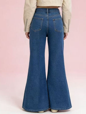 Maternity high-waisted flare jeans in blue denim with a dramatic wide leg and back pockets.