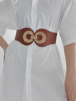 Caramel elastic waist cincher belt with gold interlocking circle buckle detail.