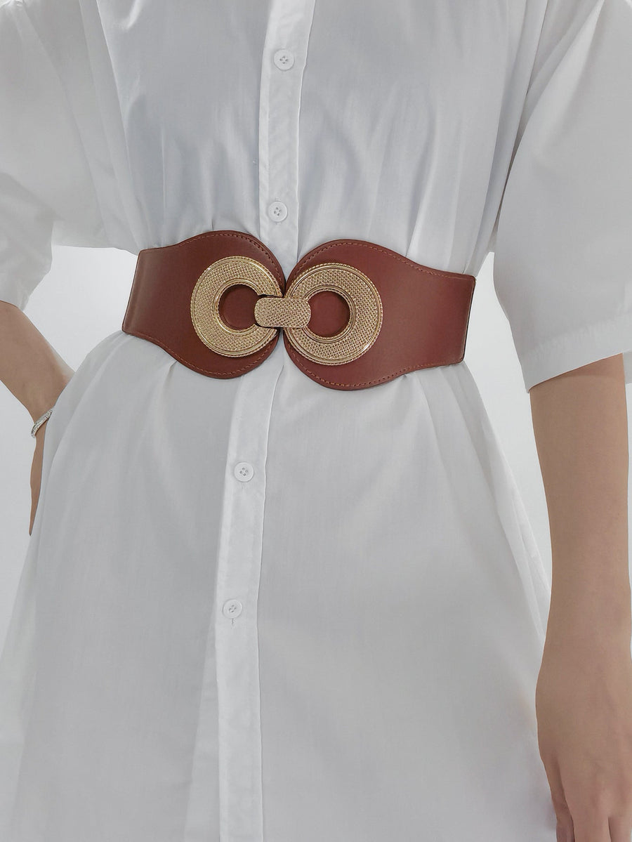 Caramel elastic waist cincher belt with gold interlocking circle buckle detail.