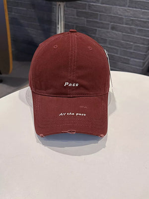 Wine red distressed baseball cap with embroidered "pass" and "All the pass" slogans.