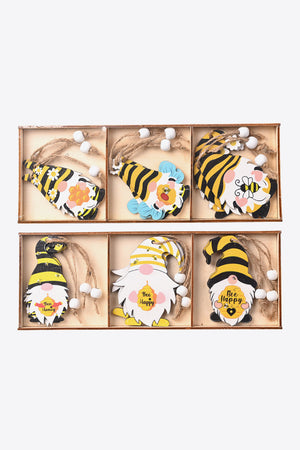 Bee gnome ornaments in yellow and black with bee designs and sayings like Bee Happy.