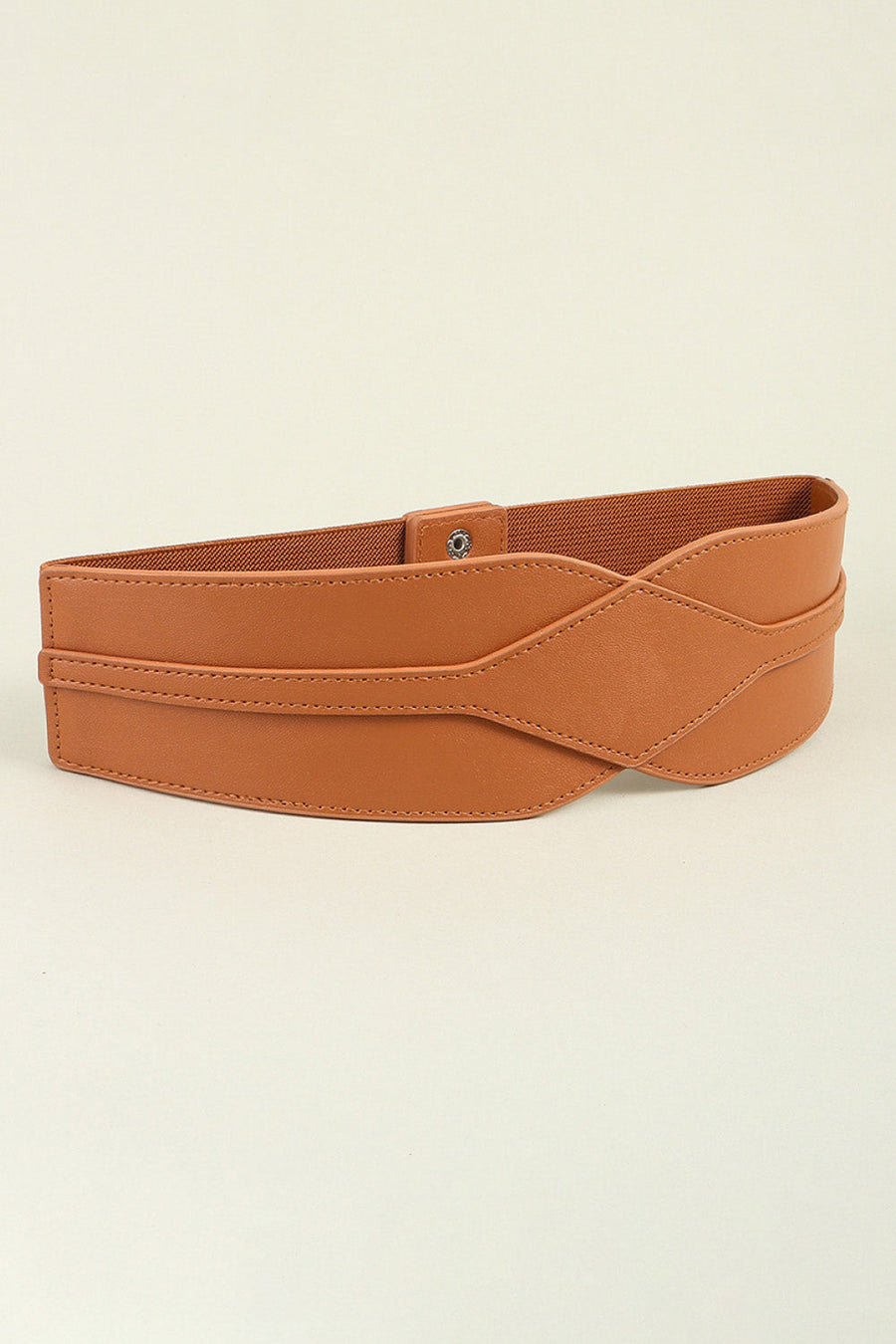 Caramel elastic belt with sculpted faux leather overlay and snap closure