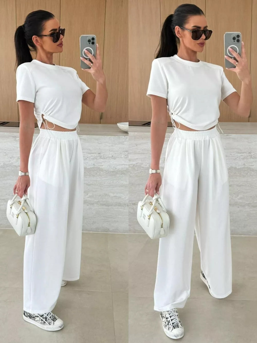 White crop top with drawstring sides and wide-leg pants set.