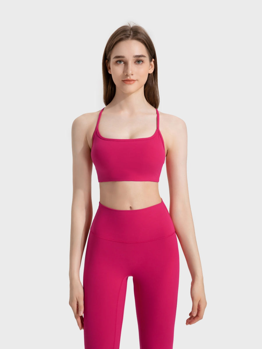 Fuchsia pink active crop top with thin straps and square neckline.
