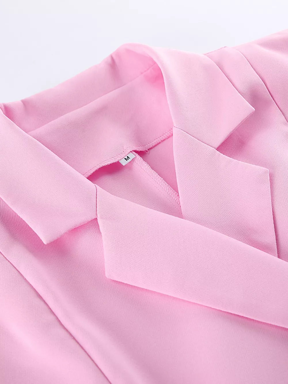 light pink fitted top, wide-leg bottom two-piece set with notch lapel