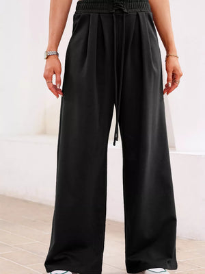Black cotton maternity pants with drawstring high waist and pleats