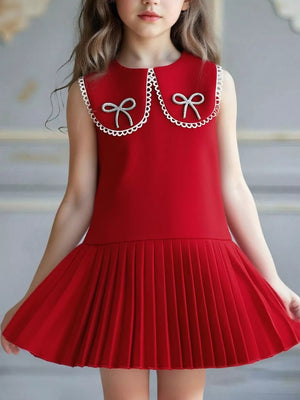 Red toddler dress with lace collar, two bows, and pleated skirt.