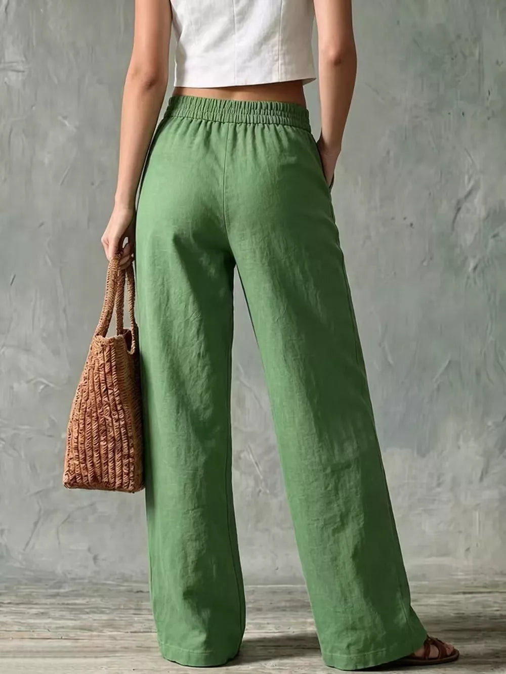 Green linen wide-leg pants with elastic waistband and pockets