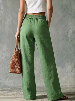 Green linen wide-leg pants with elastic waistband and pockets