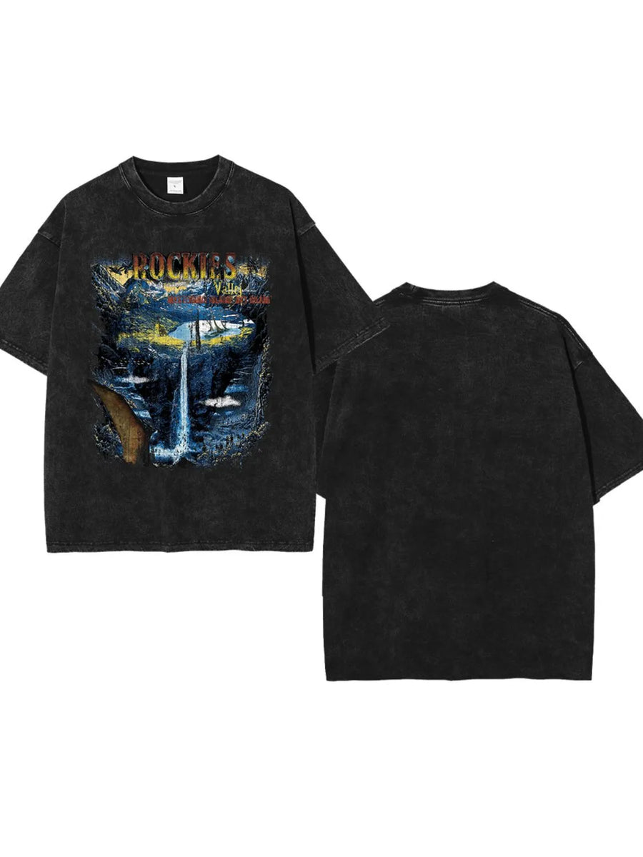 Black vintage wash graphic tee with Rockies waterfall scene.