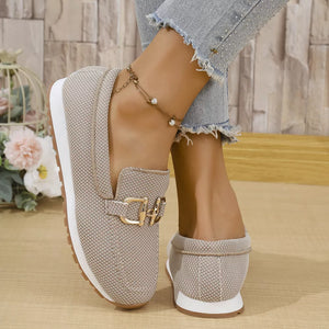 Chic khaki mesh slip-on loafers with gold buckle detail and white sole.