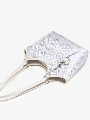 Geometric Pattern Shoulder Bag in lavender with shoulder straps