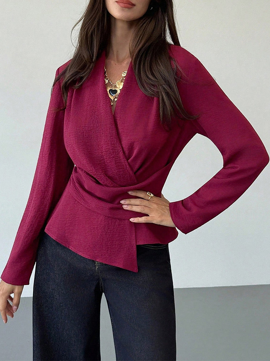 wrap top in burgundy featuring ruched and fitted fit