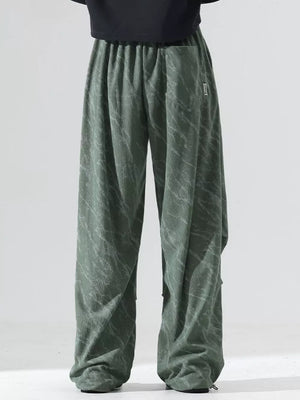 Men's sage green vintage wide leg sweatpants with drawstring and marble pattern.