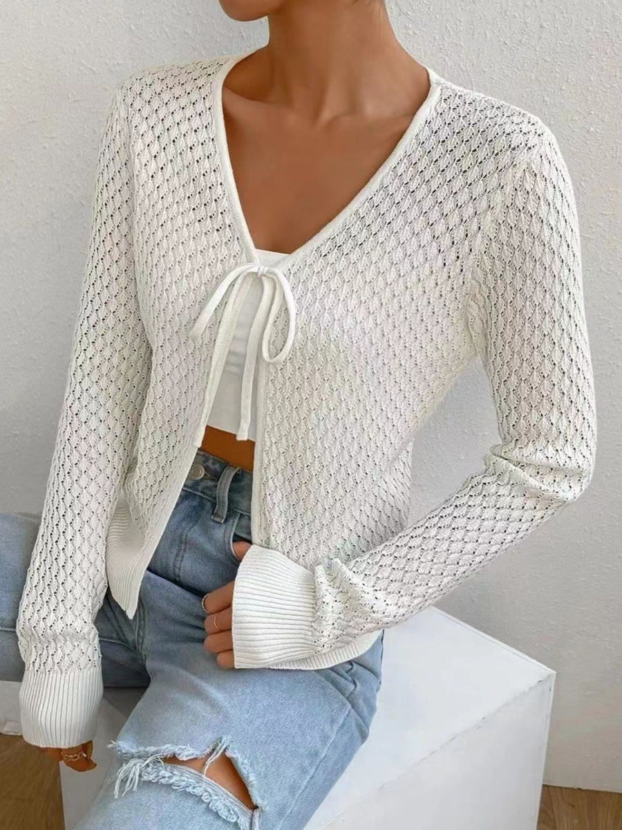 White openwork knit cardigan with tie front and bell sleeves
