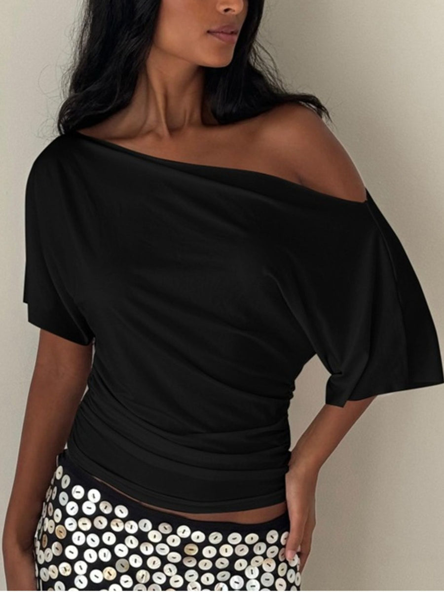Black ruched one shoulder t-shirt with short sleeves and asymmetrical neckline.