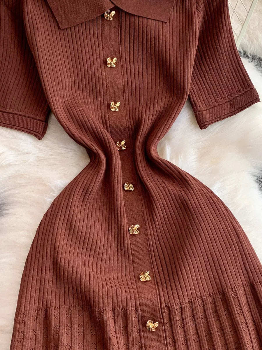 Brown ribbed knit midi dress with gold butterfly button detail and collar.