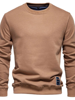 Camel crewneck sweatshirt with subtle patch detail on the hem