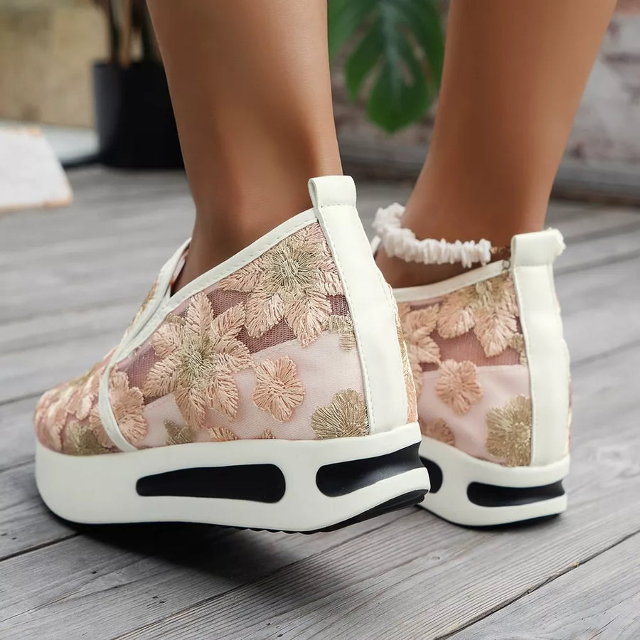 Pink floral embroidered mesh slip-on sneakers with white platform sole.